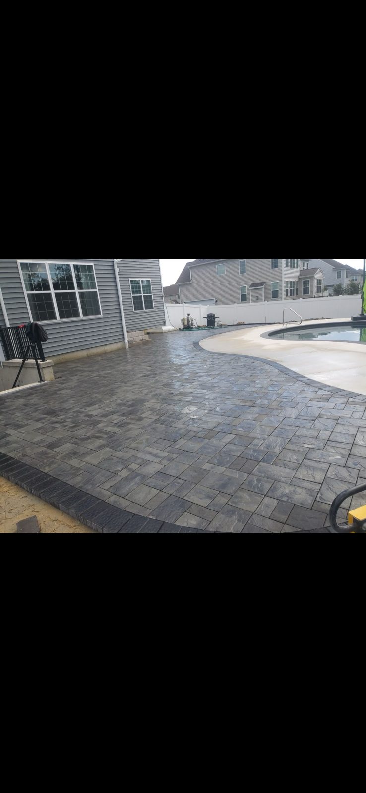 Wraparound paver pool patio