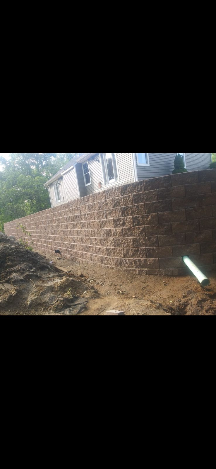 Engineered retaining wall