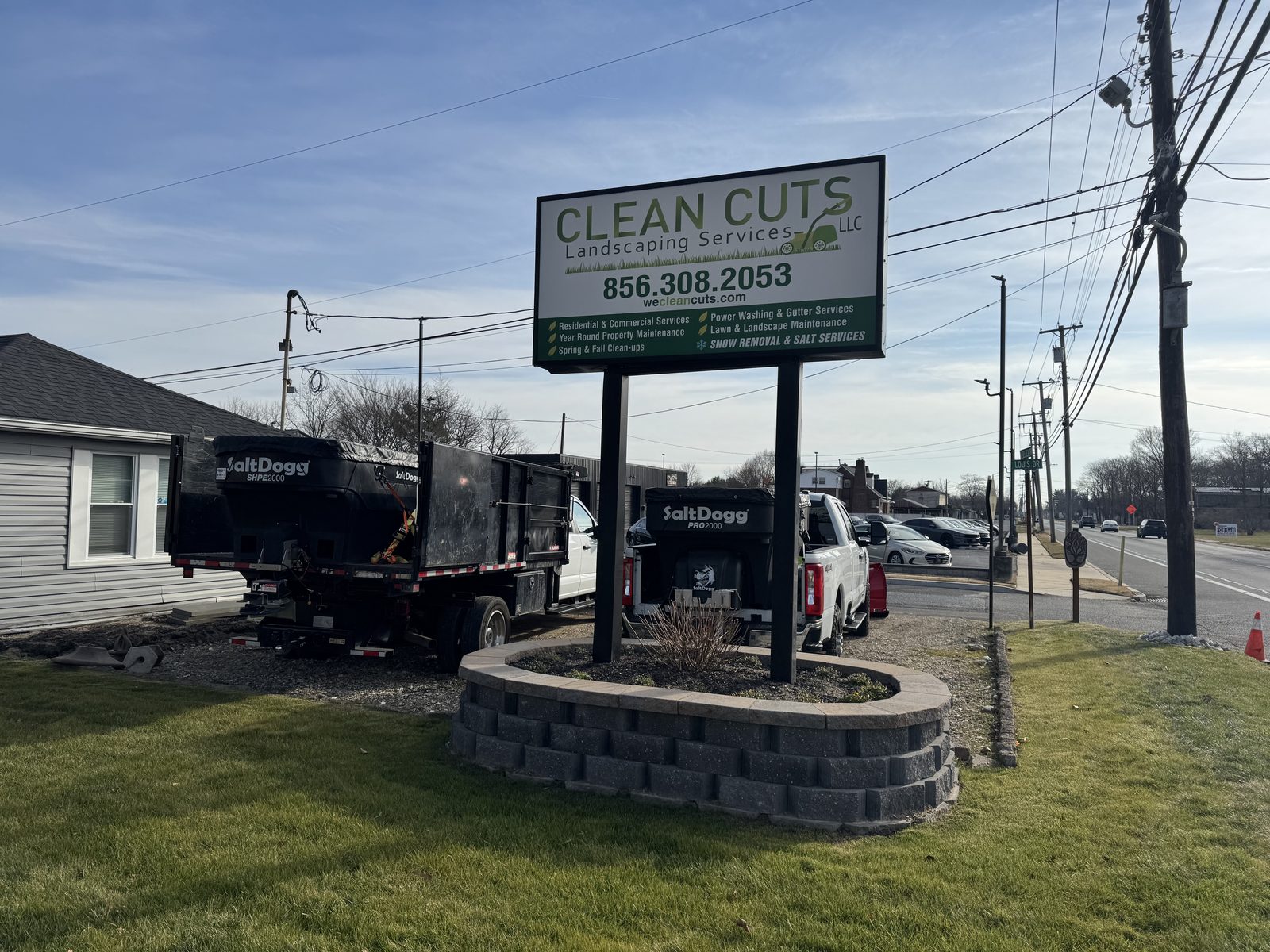 Clean Cuts Landscaping sign and plow truck at the Clayton, NJ shop